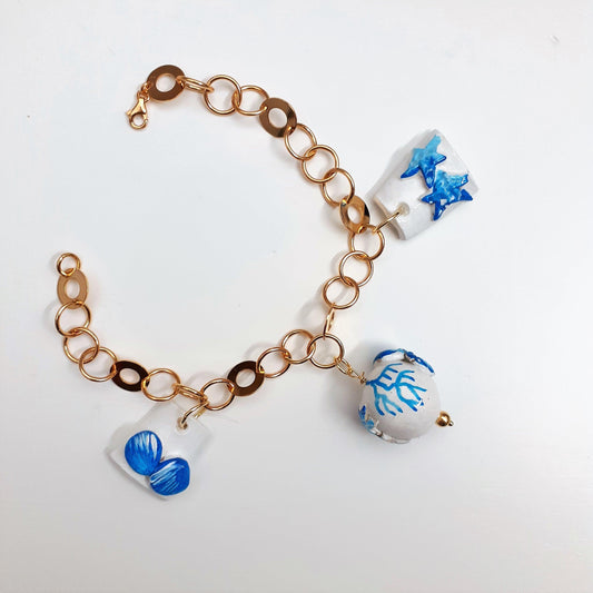 bracciale da donna estivo con conchiglie stelle marine e coralli artigianale